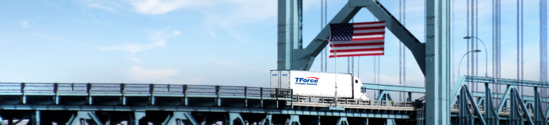 TForce Freight Canada semi-trailer driving into the USA from Canada carrying LTL shipment